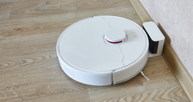 Charging robotic vacuum cleaner (example)